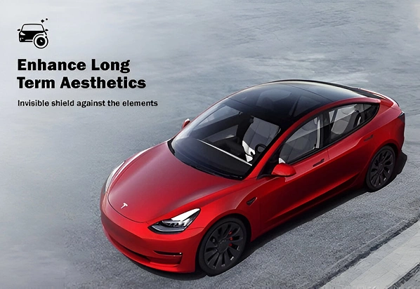 A red Tesla Model 3 parked near a curb with a sleek, glossy finish and black wheels, accompanied by text that reads “Enhance Long Term Aesthetics – Invisible shield against the elements,” promoting exterior protection.