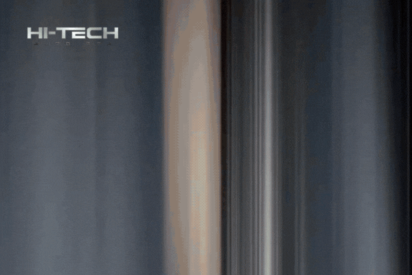 Animated GIF showing a vehicle's paint transformation from dull and scratched to ultra-glossy, mirror-like finish. The Hi-Tech Auto Spa logo appears in the top left corner as the reflection sharpens dramatically, showcasing expert detailing results.